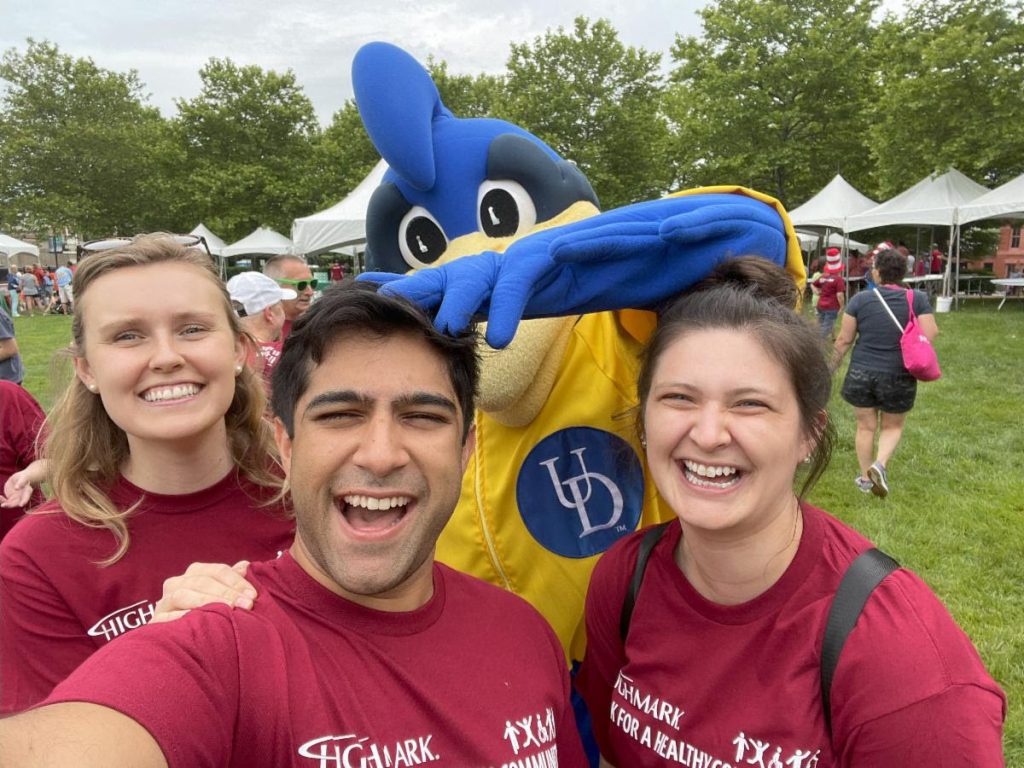 UD students in front of mascot at walk